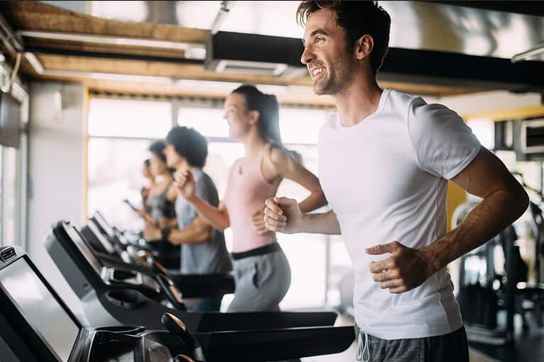 Smart and fit man in gym